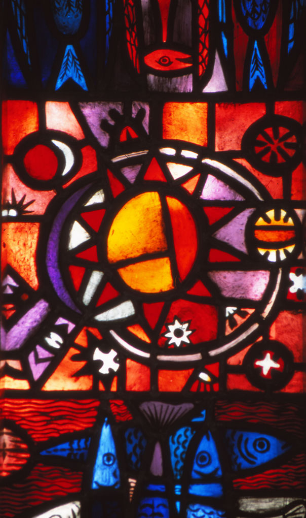 Vibrant stained-glass panel with a large radiant sun motif, surrounding celestial symbols, and stylized blue fish swimming below.